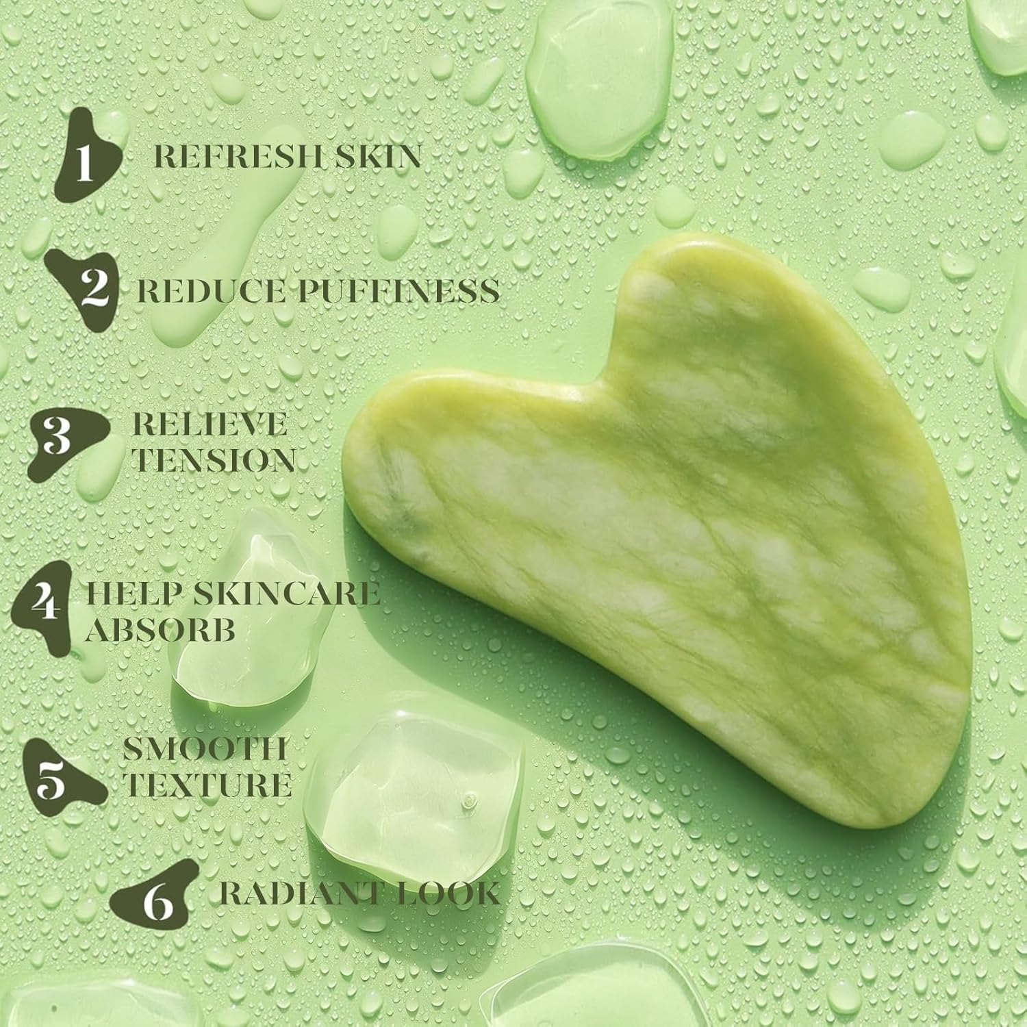 Jade gua sha stone on green background with water droplets; benefits include skin refreshment, puffiness reduction, tension relief