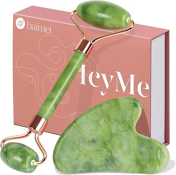 Green jade roller and gua sha set for facial massage and skincare, with branded packaging in background.