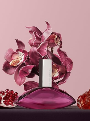 Pink orchid perfume with floral design, flanked by pomegranate and amber on a pink background. Stylish and elegant.